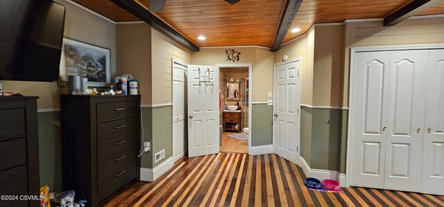 bedroom with crown molding, dark hardwood / wood-style floors, and wood ceiling