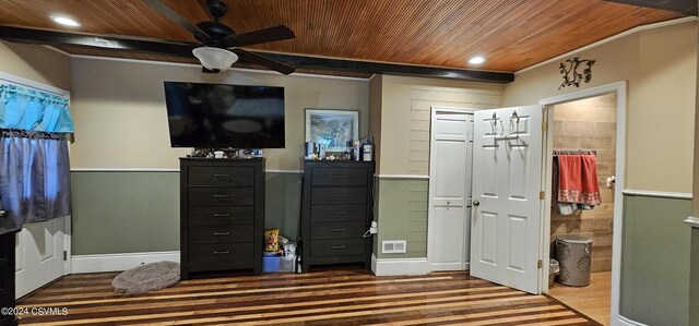 bedroom featuring wood-type flooring, ensuite bathroom, wood ceiling, and crown molding