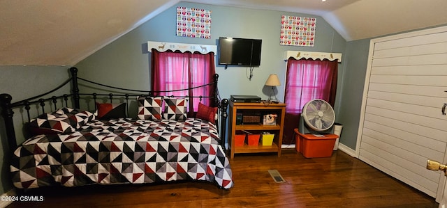 bedroom featuring vaulted ceiling and dark hardwood / wood-style flooring