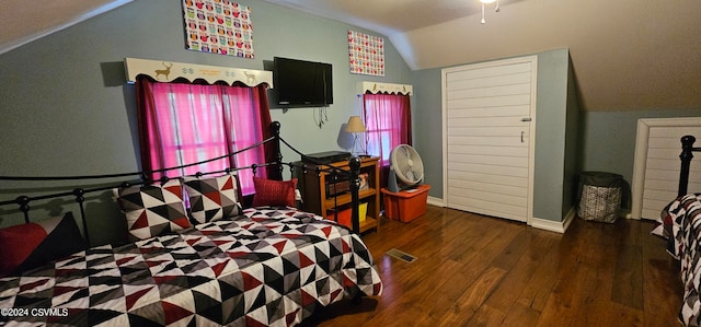 bedroom with dark hardwood / wood-style flooring and lofted ceiling