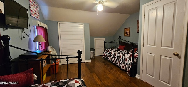 bedroom with dark hardwood / wood-style floors, ceiling fan, and vaulted ceiling