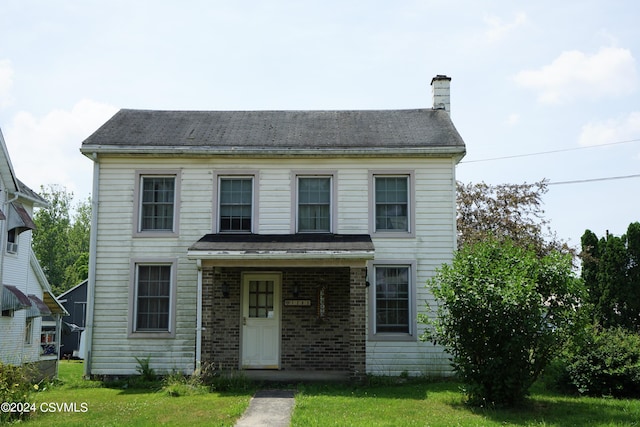 view of front of house with a front lawn