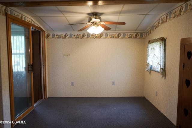 spare room featuring carpet and ceiling fan