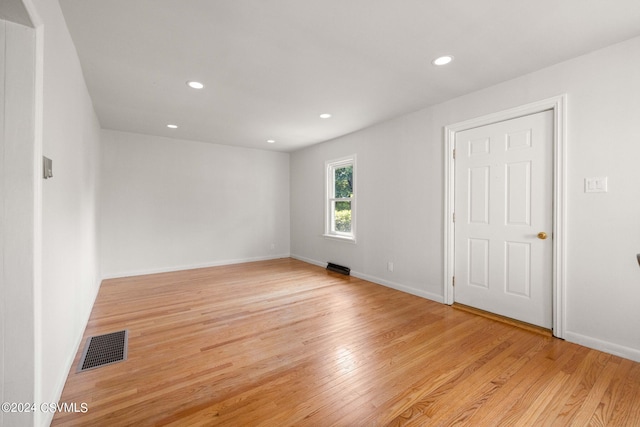 spare room featuring light wood-type flooring