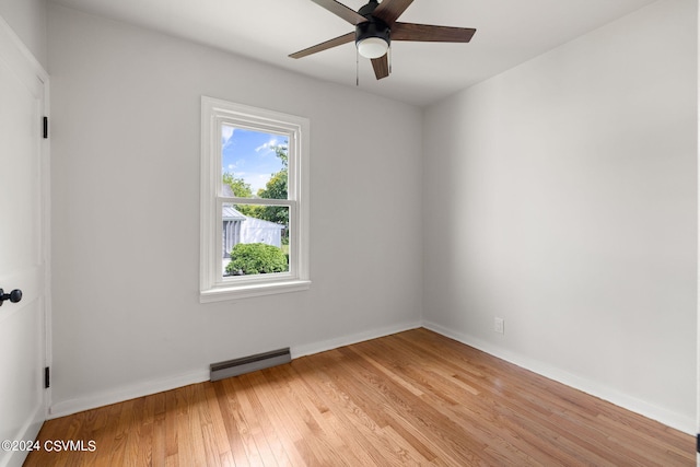 spare room featuring light hardwood / wood-style floors and ceiling fan