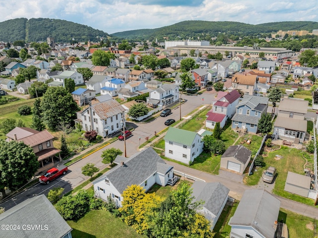 birds eye view of property with a mountain view