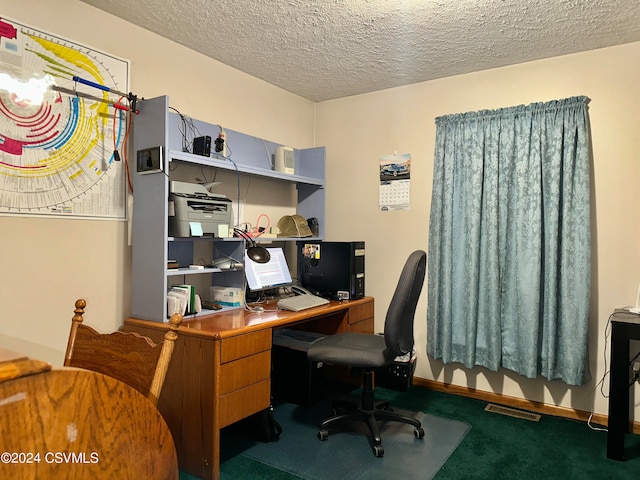 office area with carpet floors and a textured ceiling