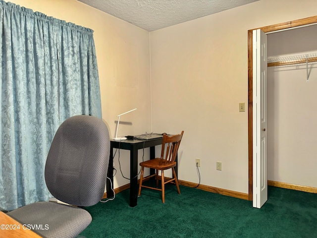 office featuring dark colored carpet and a textured ceiling