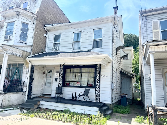 view of property featuring a porch