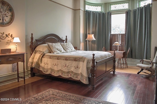 bedroom featuring dark wood-type flooring