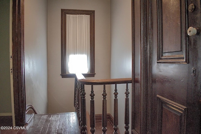 hall with dark hardwood / wood-style flooring