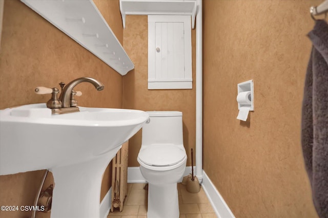 bathroom with sink, tile patterned floors, and toilet