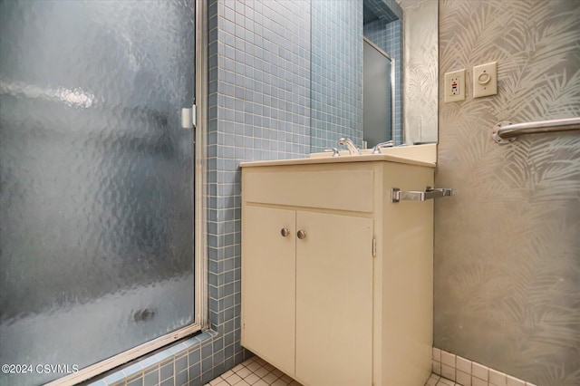 bathroom with vanity, tile patterned floors, and walk in shower