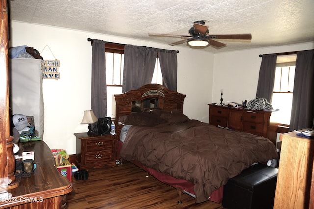 bedroom featuring a textured ceiling, ceiling fan, and wood-type flooring