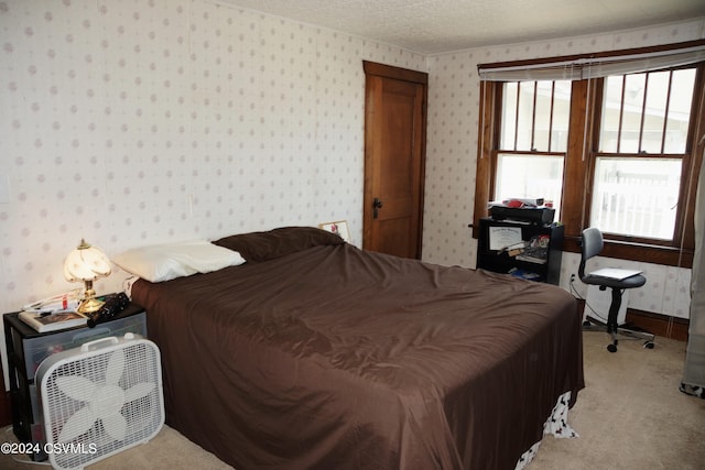 bedroom with carpet flooring and multiple windows