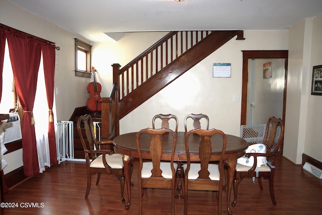 dining space with dark wood-type flooring