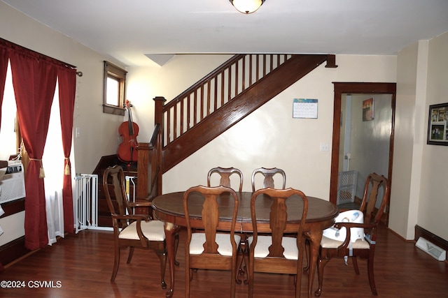 dining room with dark wood-type flooring