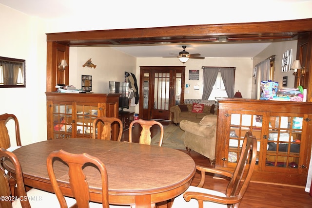 dining area with hardwood / wood-style flooring and ceiling fan