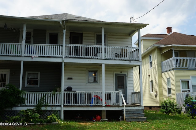 view of front of home with a balcony