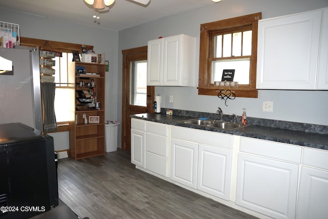 kitchen with white cabinetry, dark wood-type flooring, sink, and ceiling fan