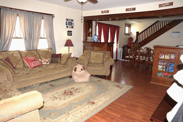 living room with ceiling fan and hardwood / wood-style floors