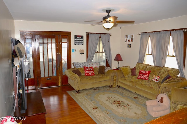 living room with ceiling fan and hardwood / wood-style floors