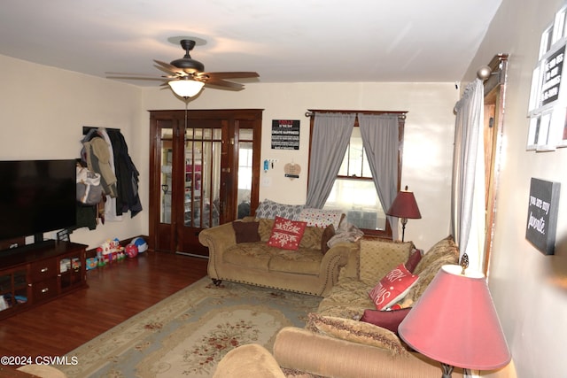 living room featuring a healthy amount of sunlight, ceiling fan, and hardwood / wood-style floors