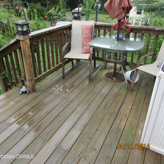 wooden deck with outdoor dining space