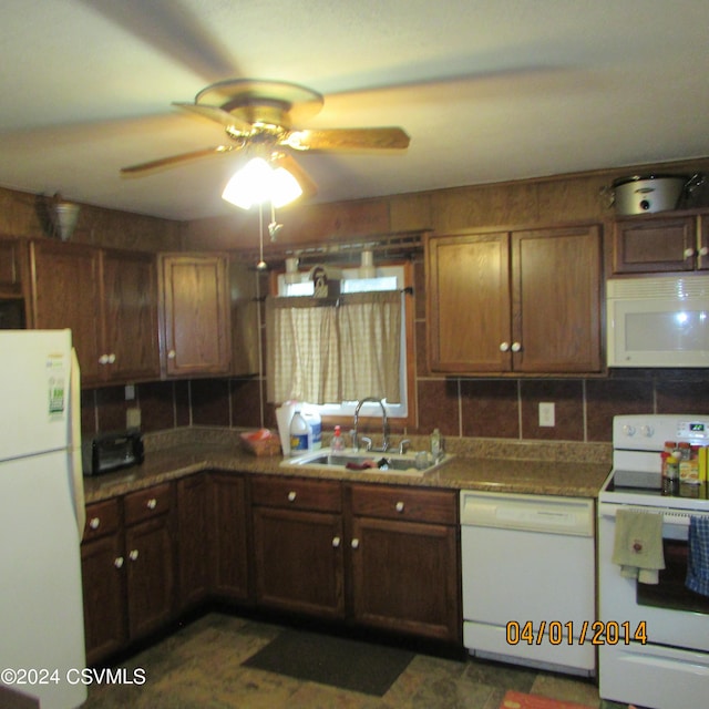 kitchen featuring a sink, white appliances, backsplash, and a ceiling fan