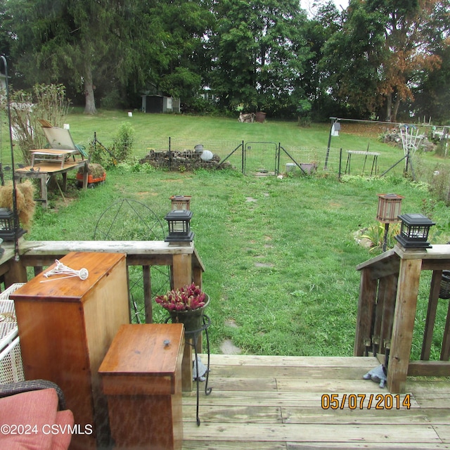 view of yard featuring a deck and fence