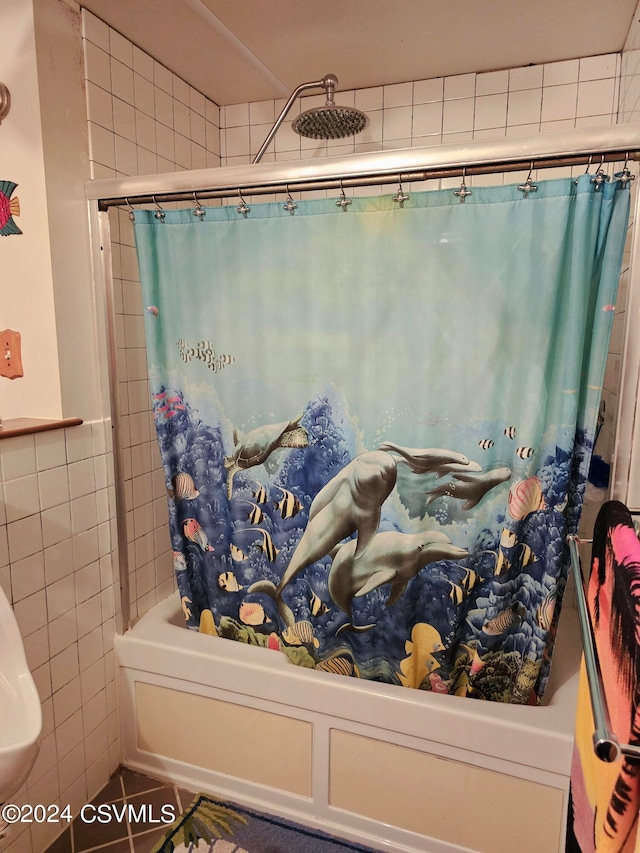 bathroom with tile patterned floors and shower / bath combination with curtain