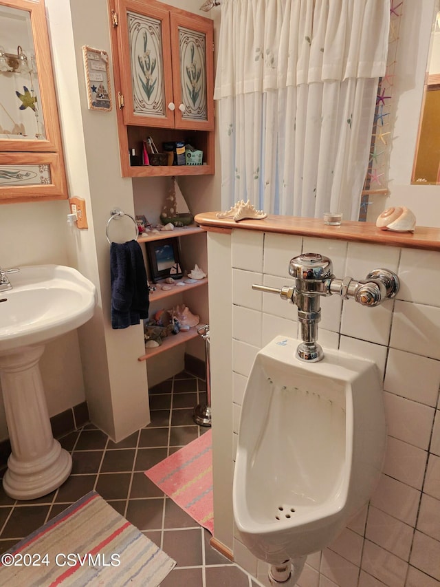 bathroom with sink and tile patterned flooring