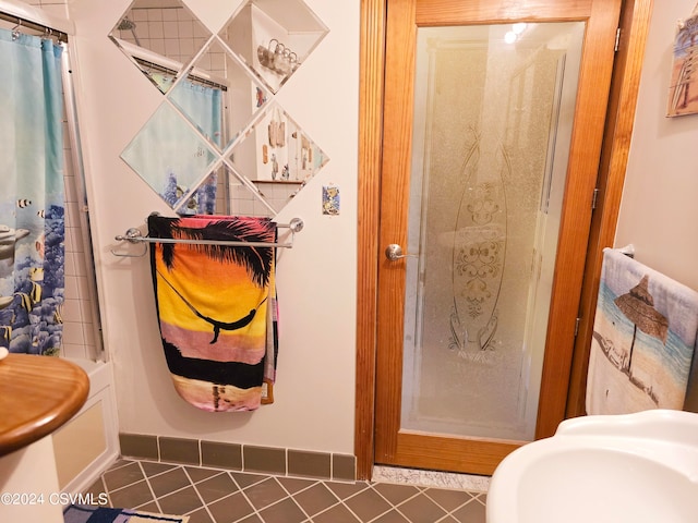 bathroom with tile patterned floors