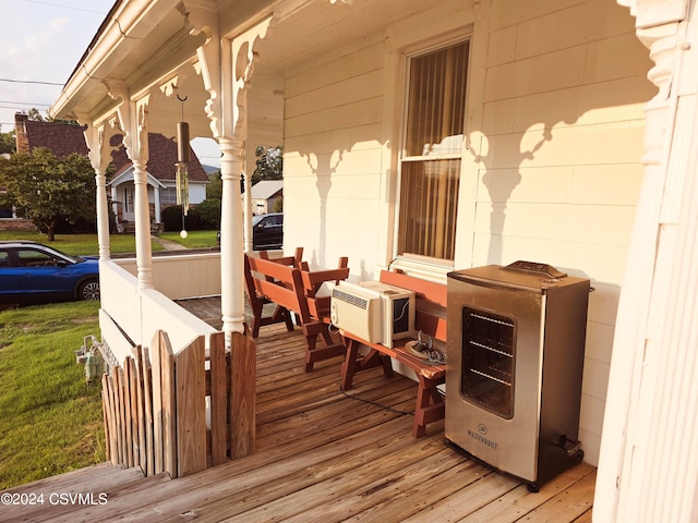 wooden deck with a lawn