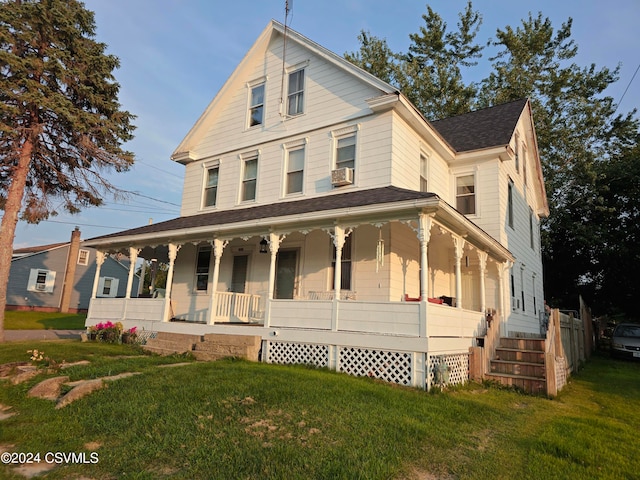 farmhouse-style home with a porch, a front lawn, and cooling unit