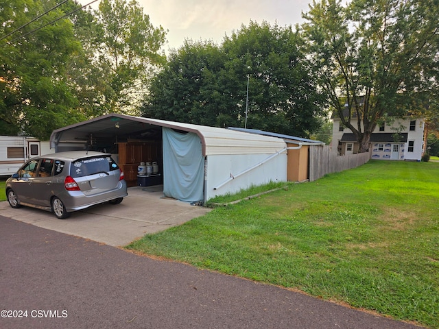 exterior space with a carport and a yard