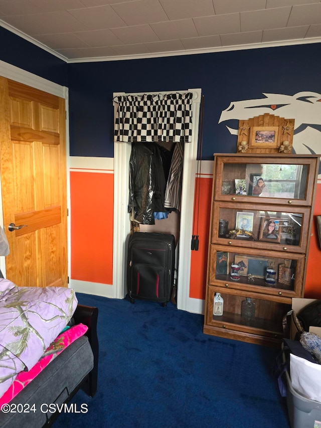 carpeted bedroom with crown molding