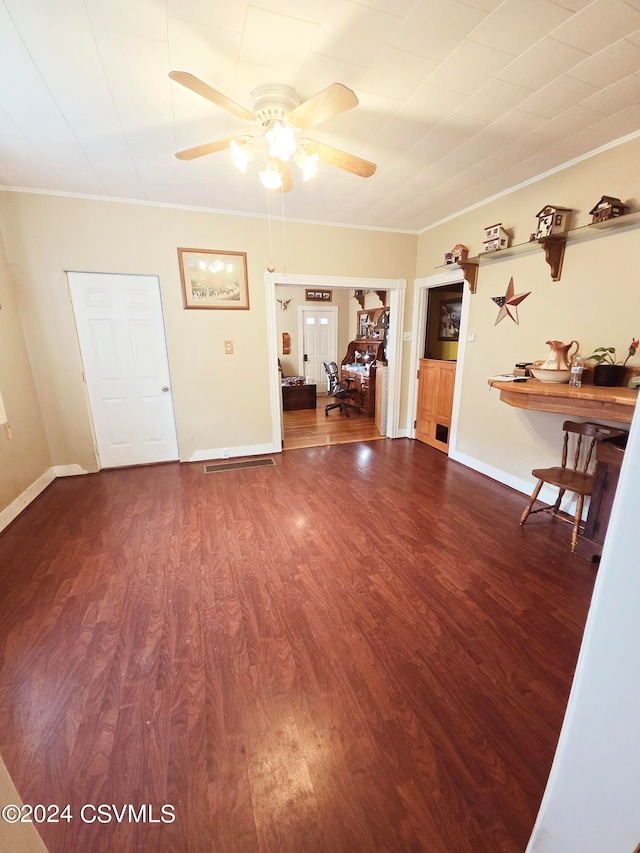 interior space with ornamental molding, ceiling fan, and hardwood / wood-style floors