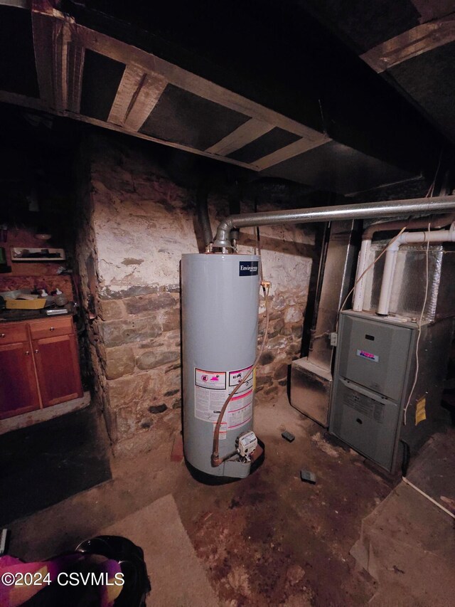 utility room featuring water heater