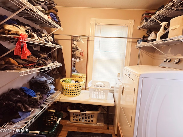 interior space with separate washer and dryer and hardwood / wood-style flooring