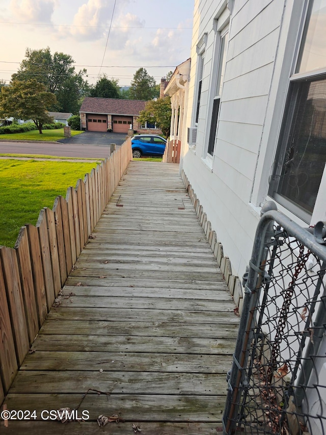 deck featuring a garage and an outdoor structure