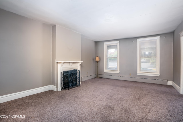 unfurnished living room featuring baseboard heating and carpet