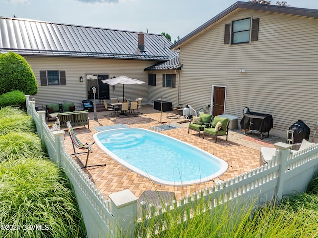 view of pool with a patio and an outdoor hangout area