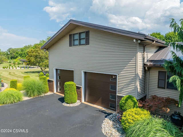 view of home's exterior with a garage