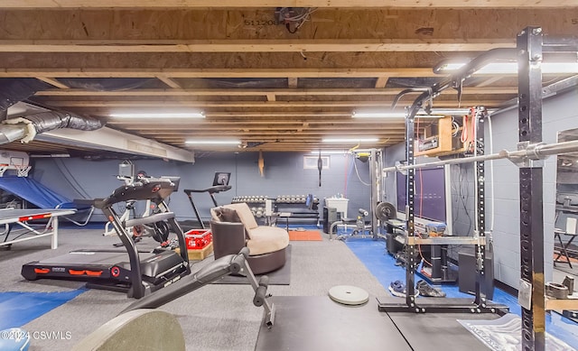 exercise room featuring concrete flooring