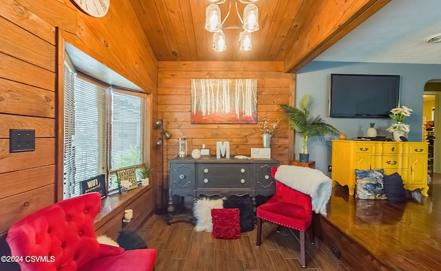 living area with wood walls, a notable chandelier, wooden ceiling, and hardwood / wood-style flooring