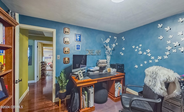 home office with hardwood / wood-style flooring