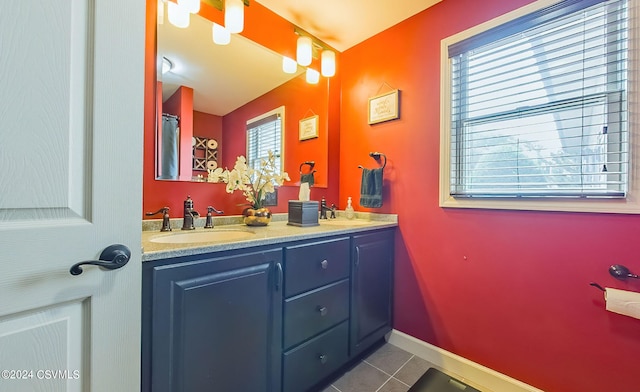 bathroom featuring tile patterned floors and dual bowl vanity