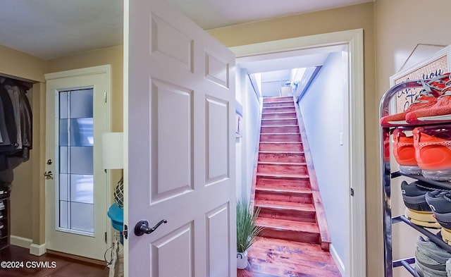 corridor with hardwood / wood-style floors