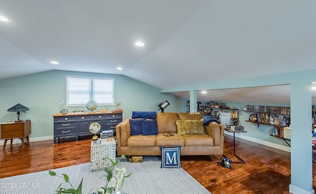 living room with dark hardwood / wood-style flooring and lofted ceiling